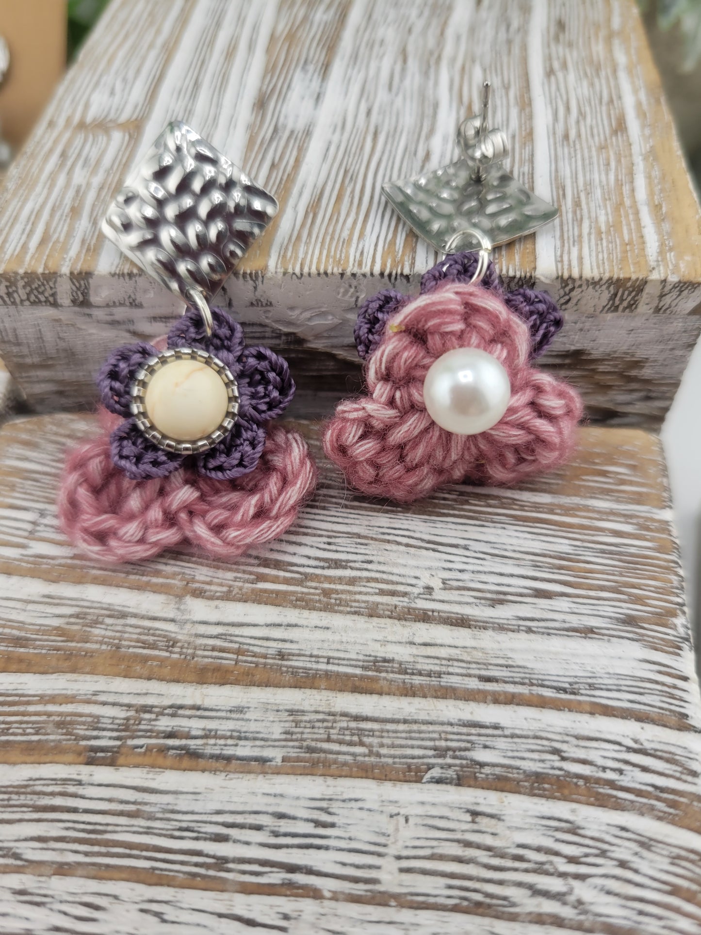 Handmade Bohemian-style Crochet Flower Earrings with a mixed colored stone center, attached to hammered Stainless steel metal earring top