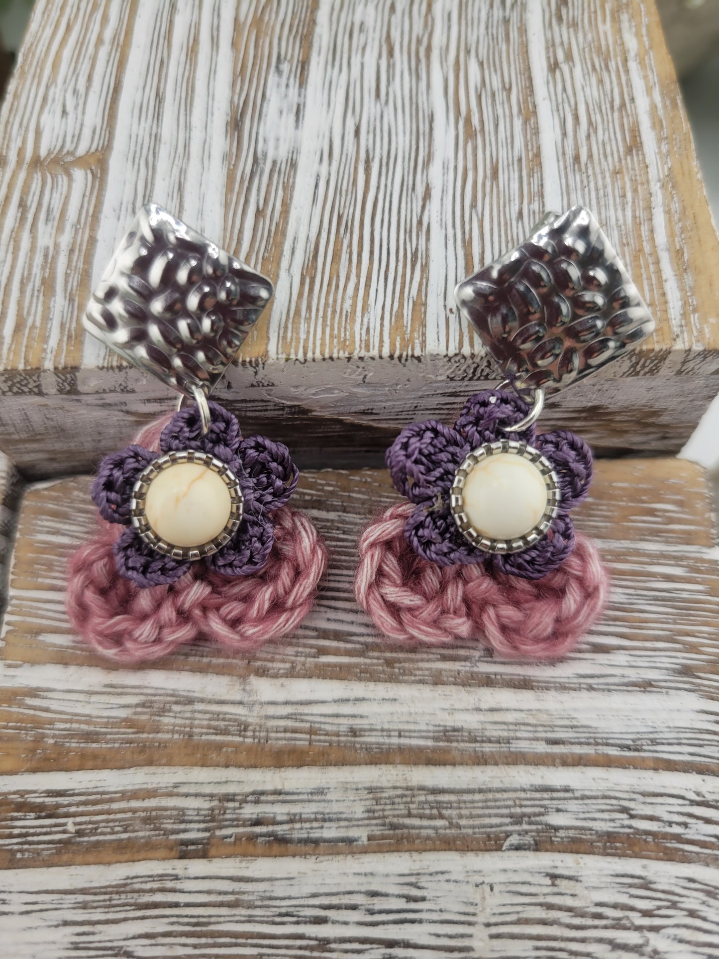Handmade Bohemian-style Crochet Flower Earrings with a mixed colored stone center, attached to hammered Stainless steel metal earring top