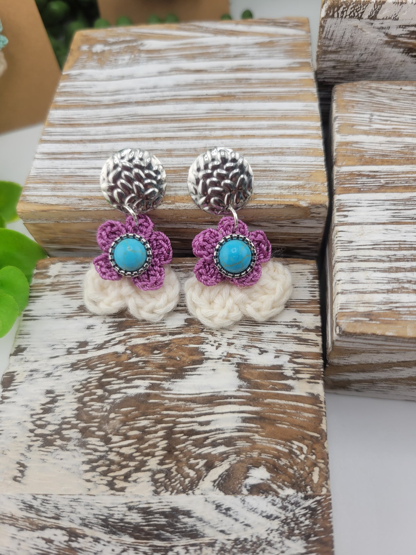 Handmade Bohemian-style Crochet Flower Earrings with a mixed colored stone center, attached to hammered Stainless steel metal earring top