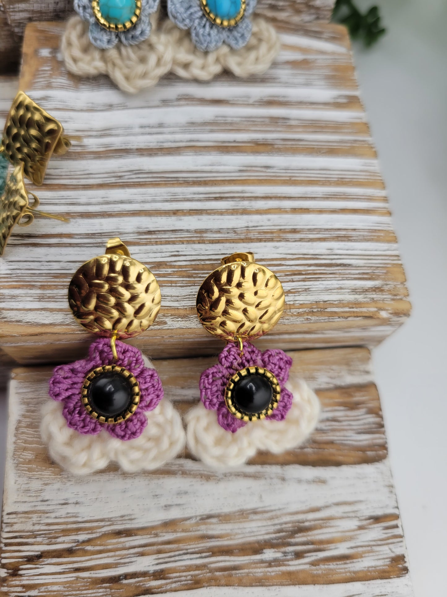 Handmade Bohemian-style Crochet Flower Earrings with a mixed colored stone center, attached to hammered 18k gold plated metal earring top