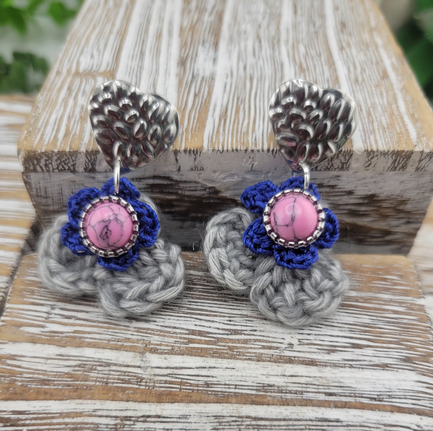 Handmade Bohemian-style Crochet Flower Earrings with a mixed colored stone center, attached to hammered Stainless steel metal earring top