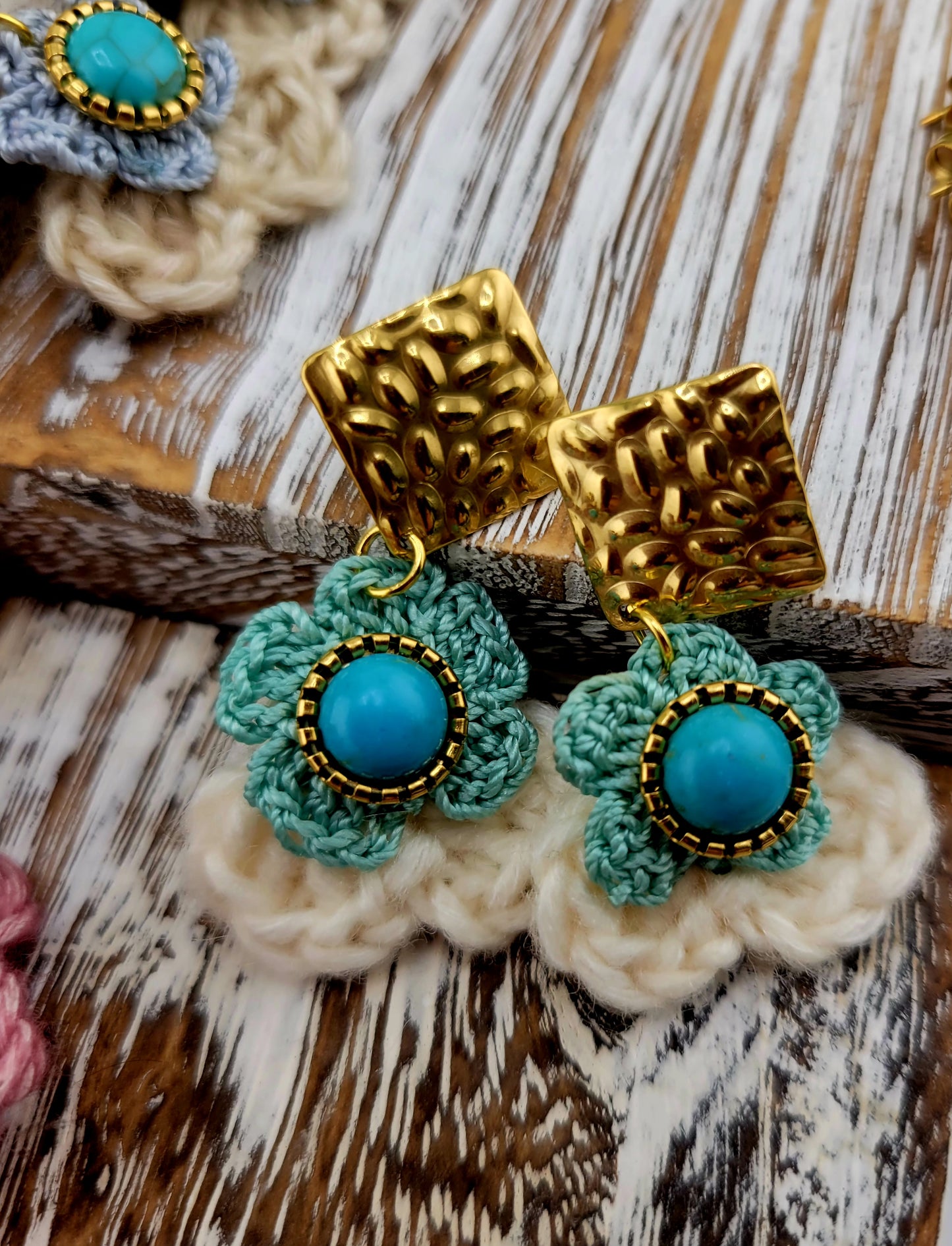 Handmade Bohemian-style Crochet Flower Earrings with a mixed colored stone center, attached to hammered 18k gold plated metal earring top