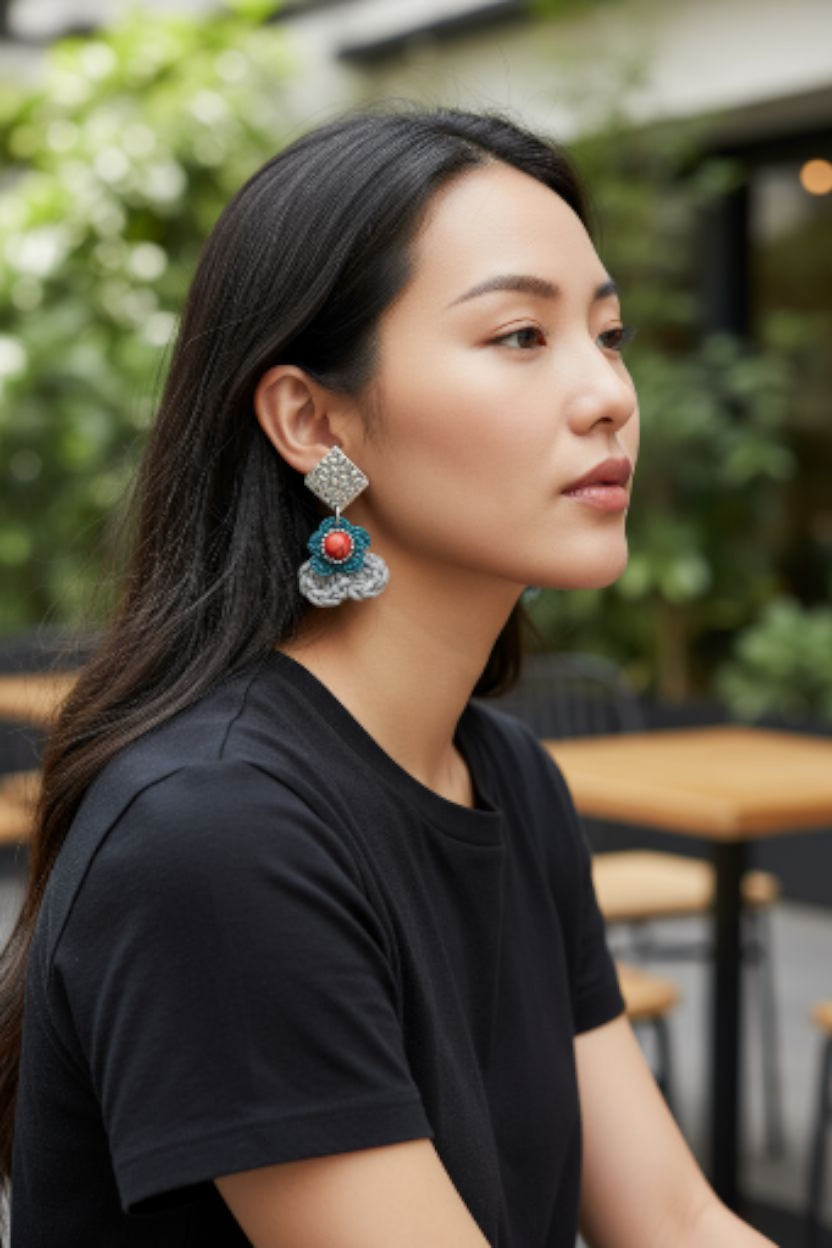 Handmade Bohemian-style Crochet Flower Earrings with a mixed colored stone center, attached to hammered Stainless steel metal earring top