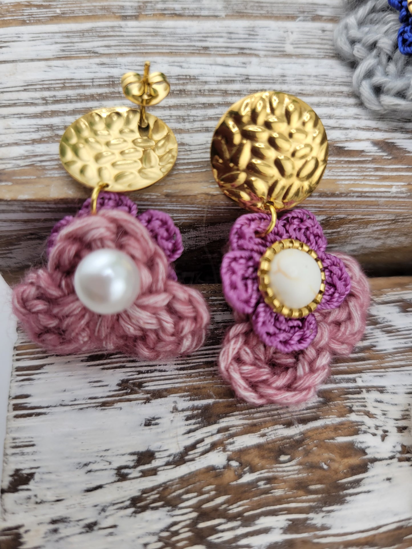 Handmade Bohemian-style Crochet Flower Earrings with a mixed colored stone center, attached to hammered 18k gold plated metal earring top