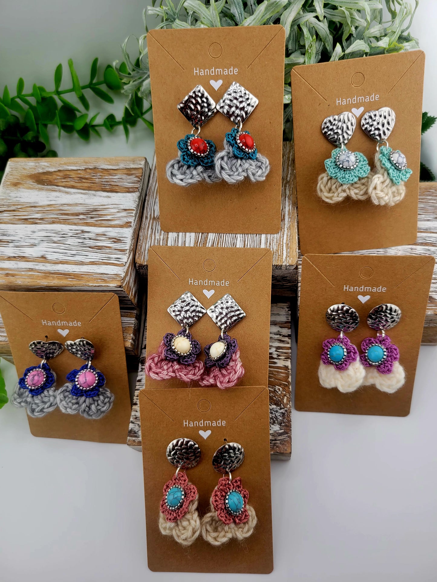 Handmade Bohemian-style Crochet Flower Earrings with a mixed colored stone center, attached to hammered Stainless steel metal earring top