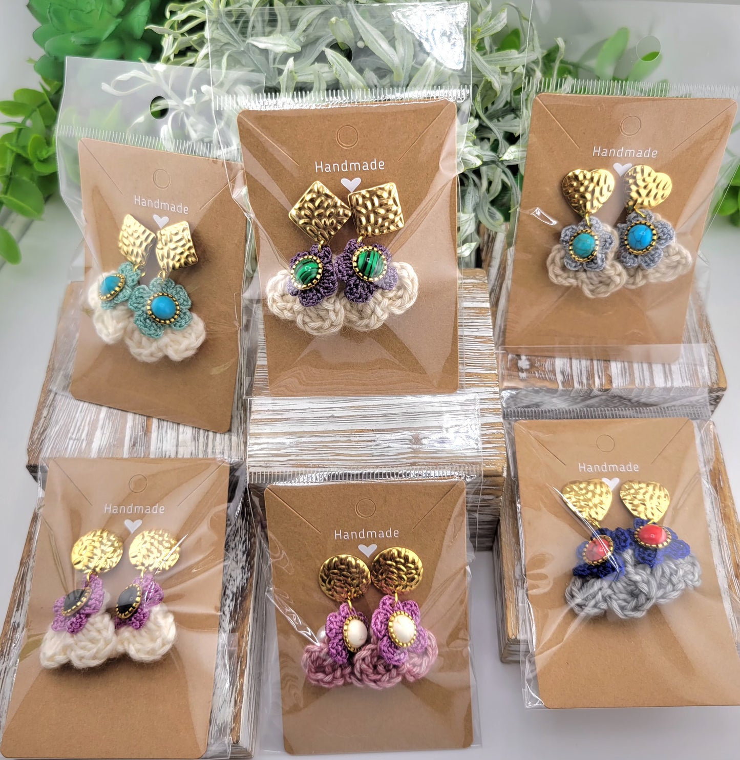 Handmade Bohemian-style Crochet Flower Earrings with a mixed colored stone center, attached to hammered 18k gold plated metal earring top